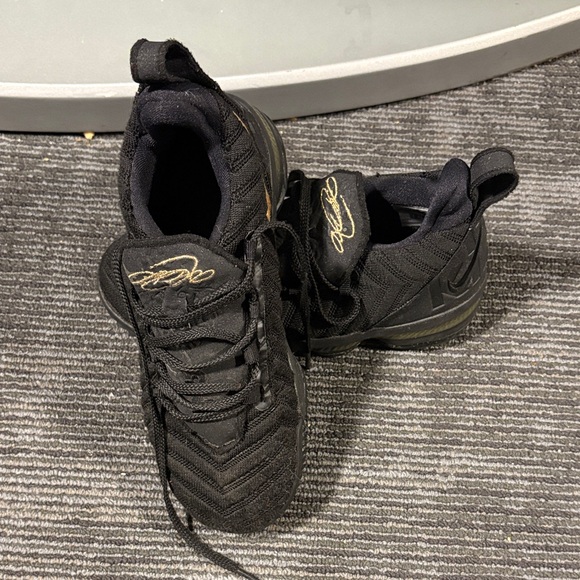 Black Sneakers with Gold Accents